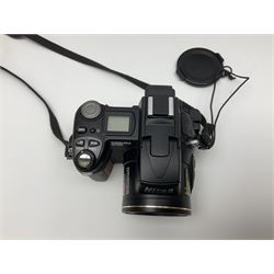 Nikon Coolpix 8700 camera body, serial no 3220838, with Zoom Nikkor Ed 8.9-71.2mm 1:2.8-4.2 lens, together with Canon digital video camcorder and other digital cameras and camera equipment