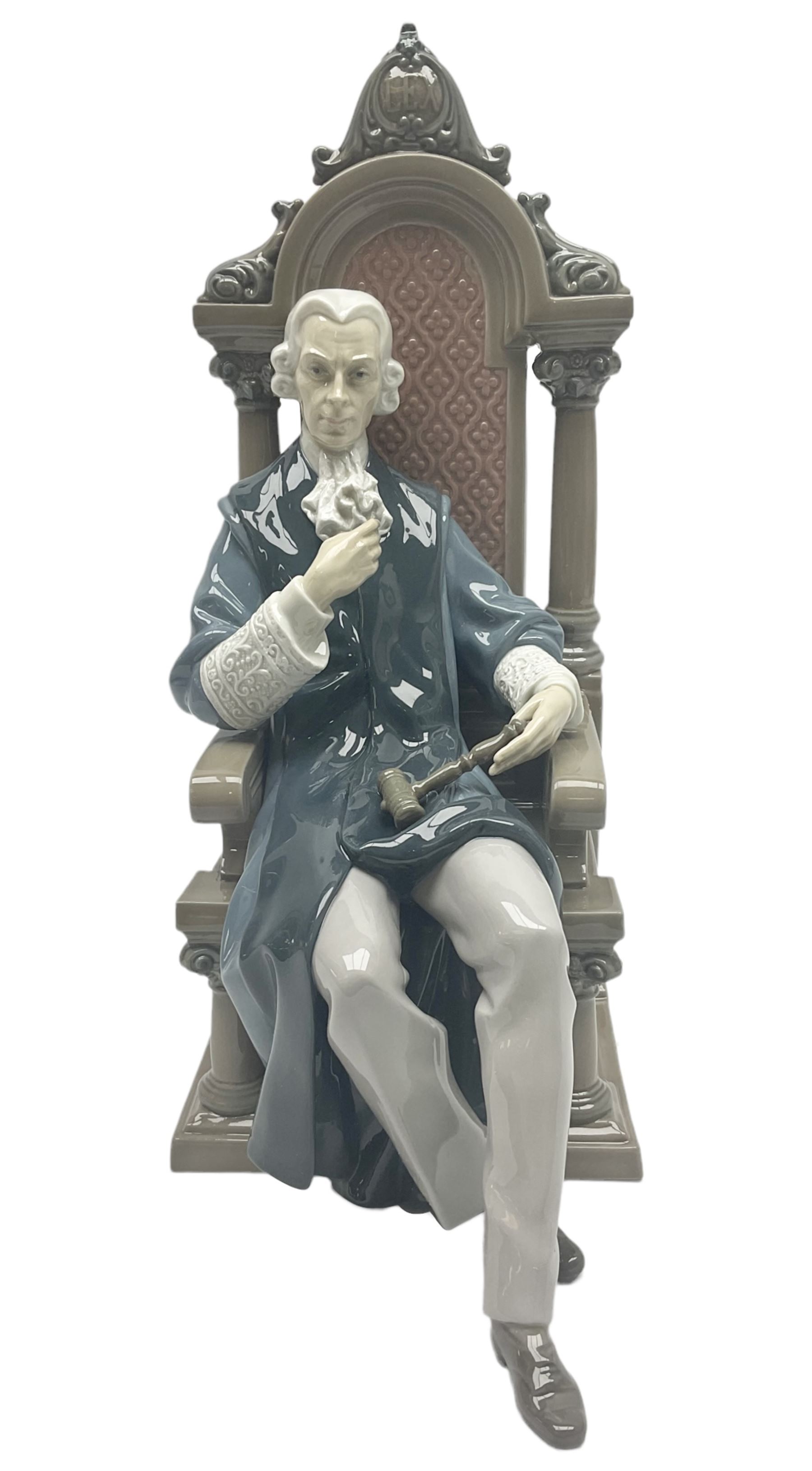 Lladro figure, Justice, modelled as a judge sat in a char, sculpted by Salvador Furió, with original box, no 5489, year issued 1988, year retired 1993, H34cm 