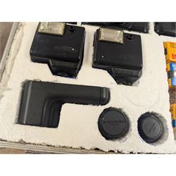 Two Pentax Auto 110 camera bodies and accessories including flashes, winder and lenses, all within two flight cases
