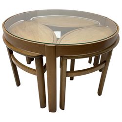 Mid-20th century teak nest of tables, circular coffee table with inset glass top with three elliptical  nesting table 