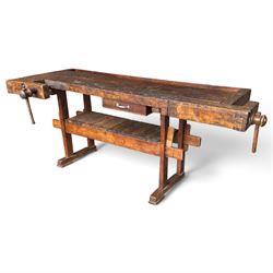 Large early 20th century rustic stained reclaimed pine workbench, the substantial plank to...