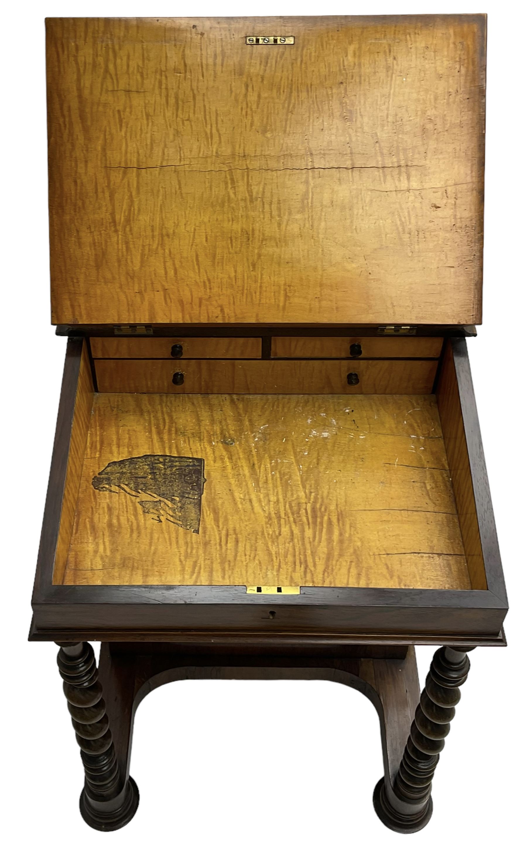 Victorian walnut Davenport, hinged sloping top with inset leather writing surface, enclosing satinwood lined interior with two drawers over faux drawer, fitted with inkwell drawer and pen compartment to the side over four drawers with an opposing false set, raised on spiral turned supports united by a shaped platform base