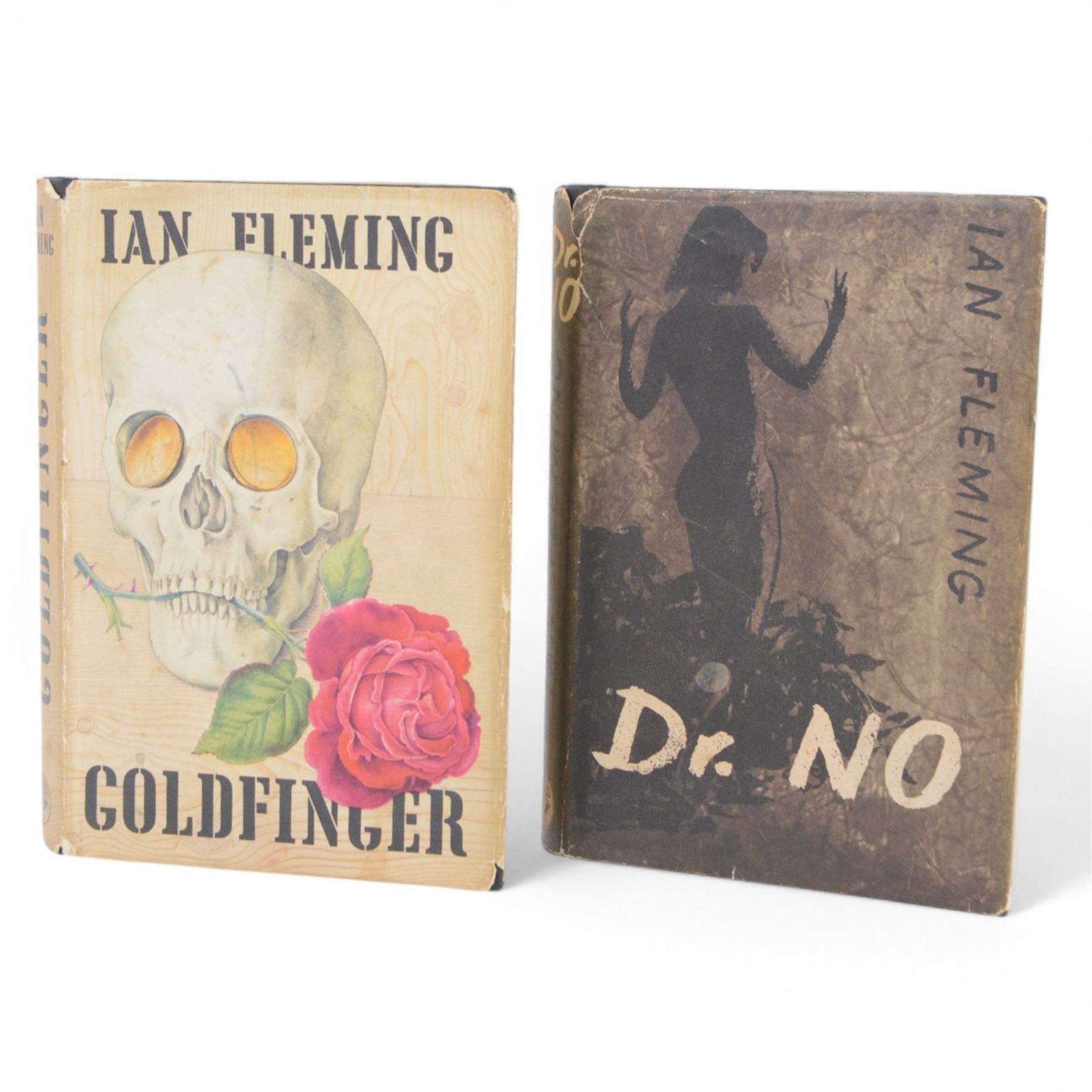 Fleming Ian: Dr. No first edition 1958, pub. Jonathan Cape London, with plain black cover and dustjacket, together with Goldfinger first edition, second impression 1959, pub. Jonathan Cape London, with embossed black cloth/gilt cover and dustjacket (2)