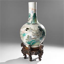 Chinese Kangxi period famille verte vase, the body finely painted with a continuous narrative scene of figures inside and out of a pavilion complex, beside a river, rocks and trees, character mark to base, raised upon a hardwood stand, overall H47cm