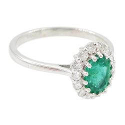 18ct white gold oval cut emerald and round brilliant cut diamond cluster ring, emerald approx 0.85 carat, total diamond weight approx 0.30 carat
