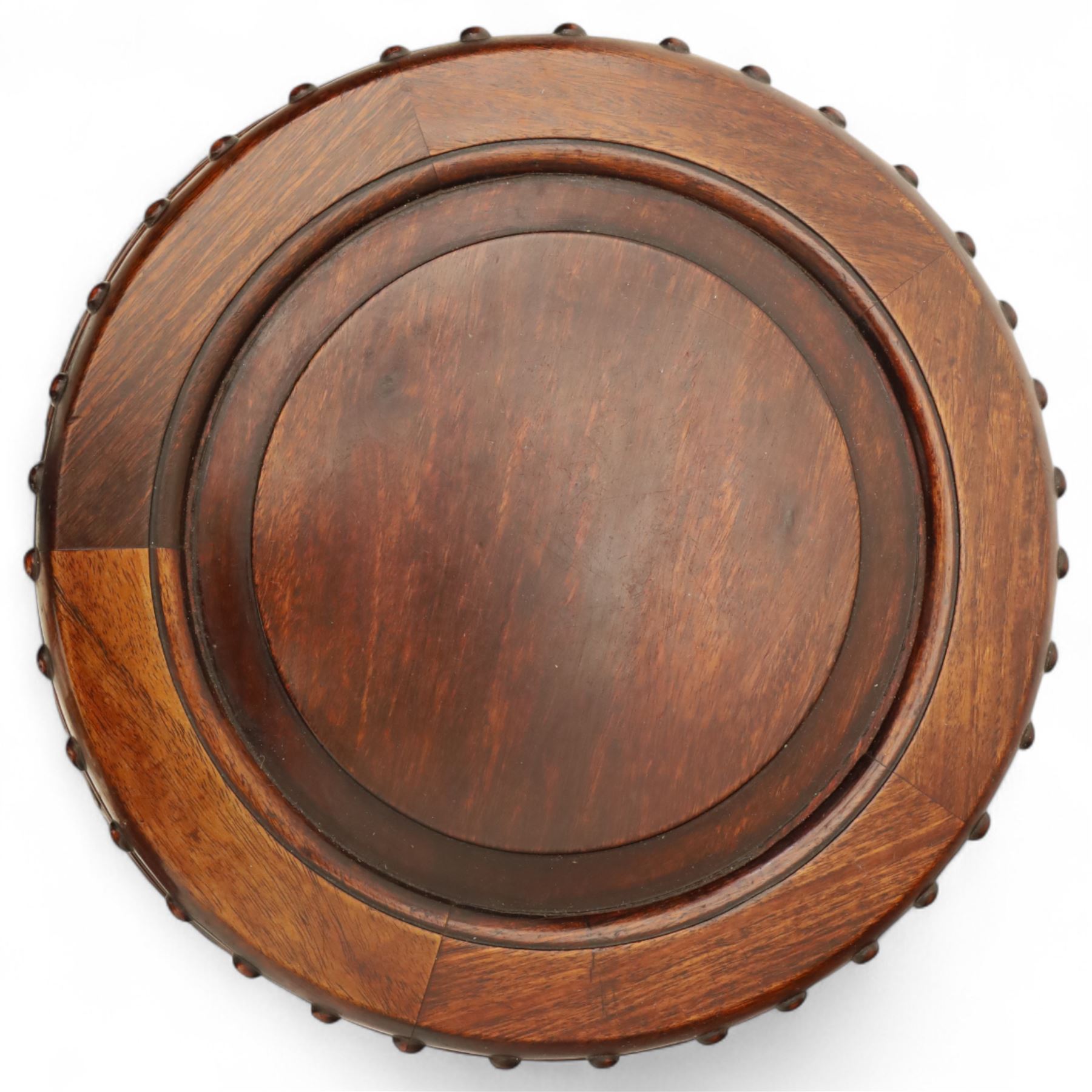 Pair of early 20th century Oriental hardwood barrel seats, of drum form with shaped apron and pierced panels, carved with stylised scrollwork and studded detail to the top