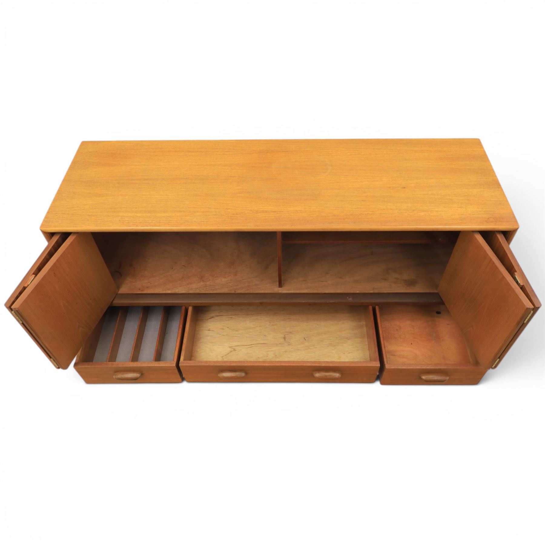 G-Plan - 'Brasilia' teak sideboard, with rectangular top above two concertina doors, above four drawers raised on cylindrical supports