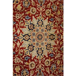  Najaf Abad red ground rug, central medallion, repeating border, 378cm x 263cm  