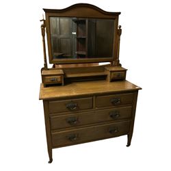 Edwardian oak dressing chest, fitted with two short and two long drawers, swing mirror
