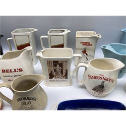 Collection of ceramic pub jugs and ashtrays, including Senior Service ashtray, Bell's old scotch whiskey ashtray,Arthur Bell & sons jug, Beefeater gin jug, two Black and White scotch whiskey jugs, etc    