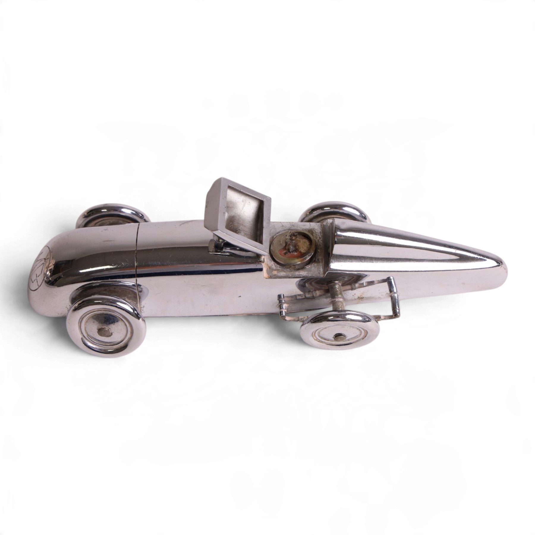 MG Magic Midget table lighter, circa 1933, chrome plated, engraved to the nose and on one side, marked beneath 'S&M, Made in England, Pat. no. 373219' 