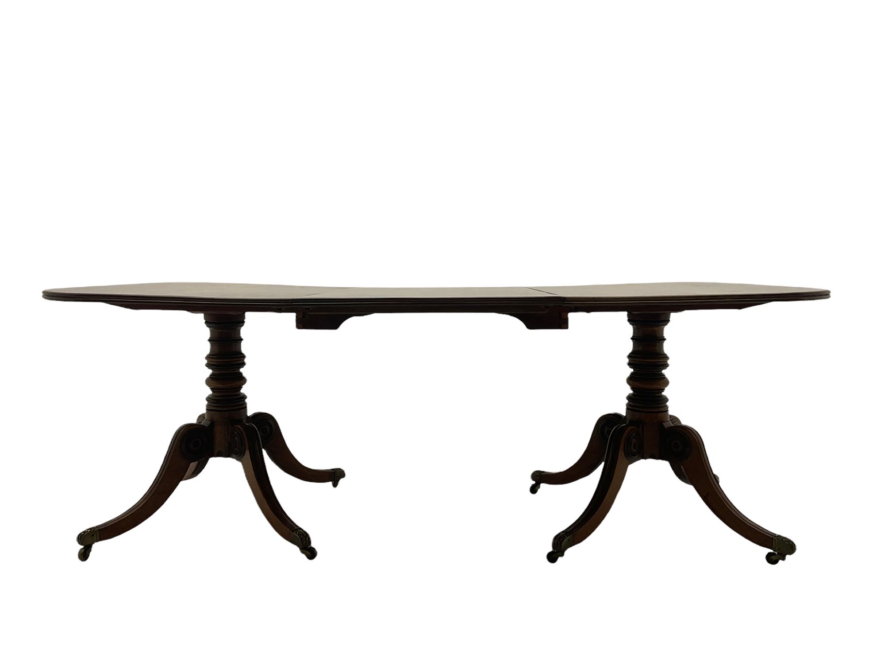 Early 19th century mahogany extending dining table, the two Dends each