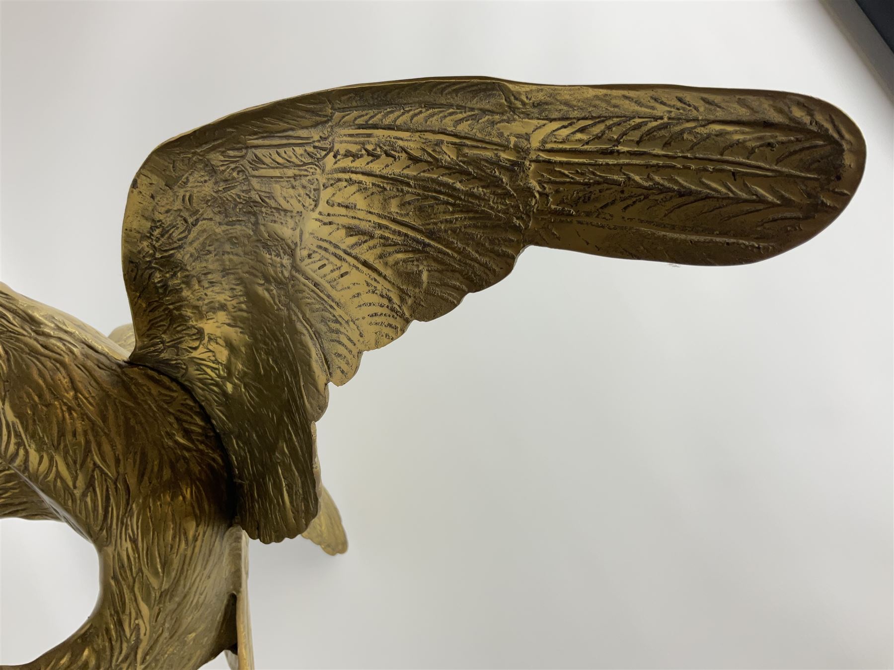 Large brass figure of an eagle on a branch, H51.5cm