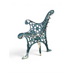 Pair of ornate painted cast iron bench ends, painted in green