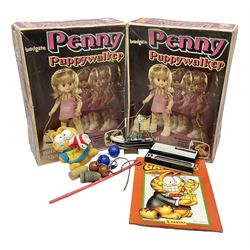 Two boxed Bradgate Penny Puppywalker dolls; Garfield soft toy and Panini sticker album; boxed Stylophone with instructional 45rpm record; and other toys