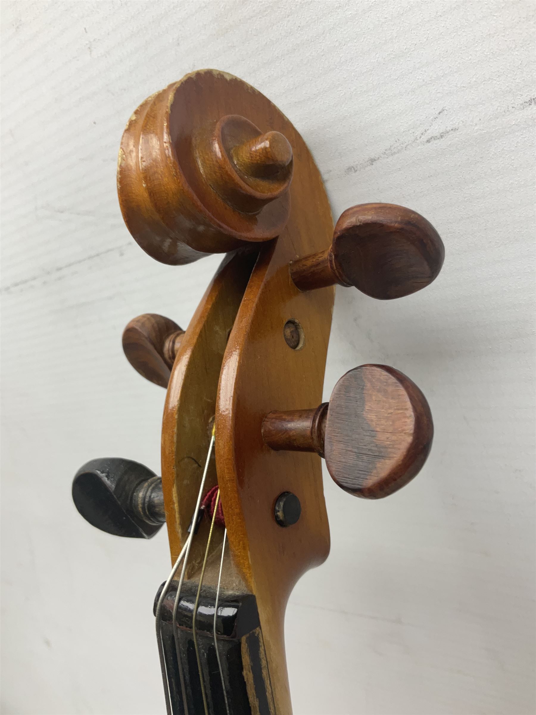 Four Chinese graduated violins - full size with 35.5cm two-piece back; three-quarter size with 33.5cm two-piece back; half size with 31cm two-piece back; and quarter size with 27.5cm two-piece back; all cased except full size; one with bow (4)