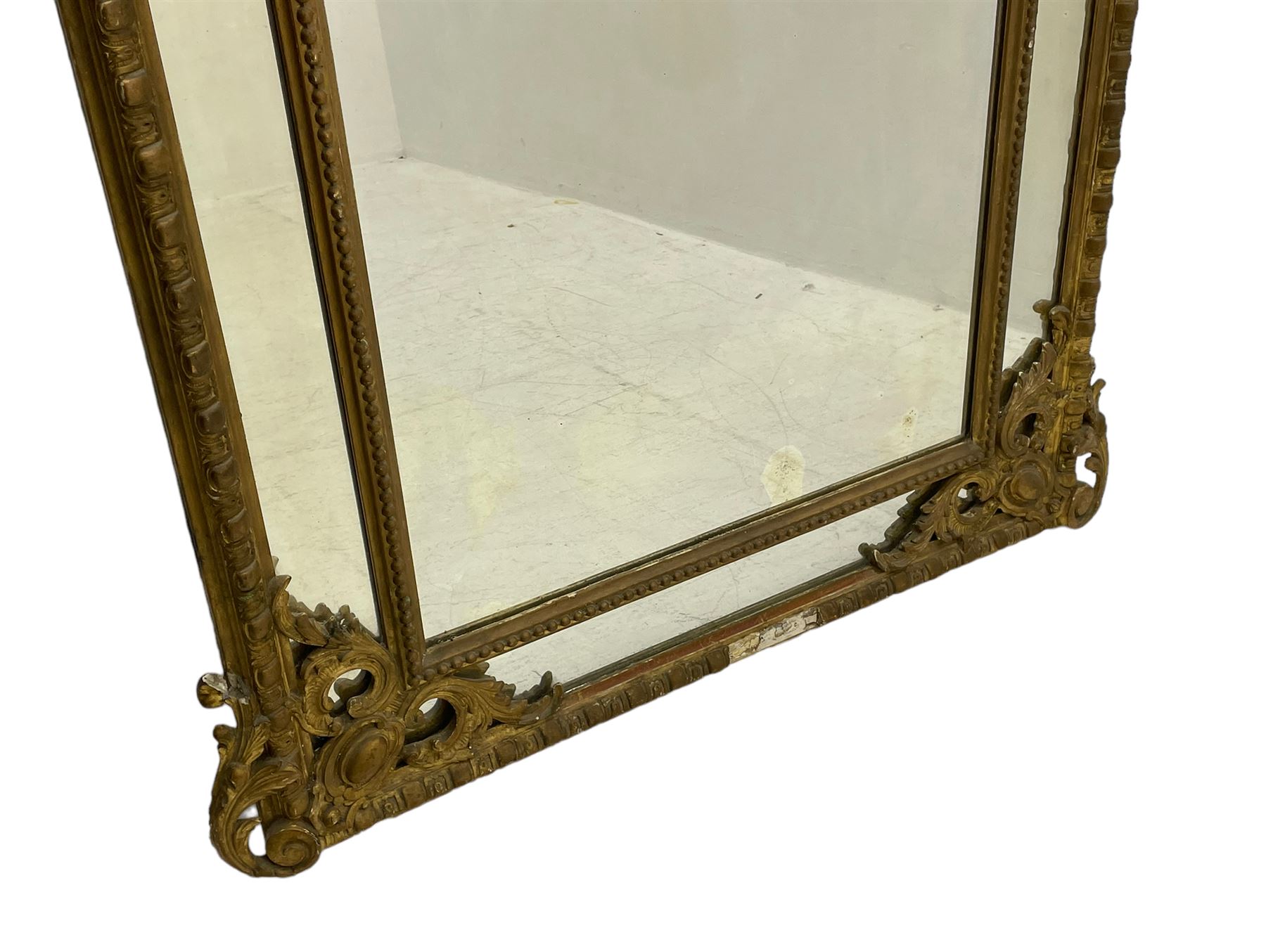 19th century giltwood and gesso pier mirror, shell cartouche pediment decorated with flower heads and scrolling foliage, two bird motifs to each side, egg and dart moulded frame with beaded inner slip, plain mirror plate, each corner mounted by scrolled acanthus leaves and cartouches