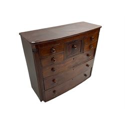Early 19th century mahogany bow front chest, fitted with eight drawers, the corners fitted with reeded quarter columns