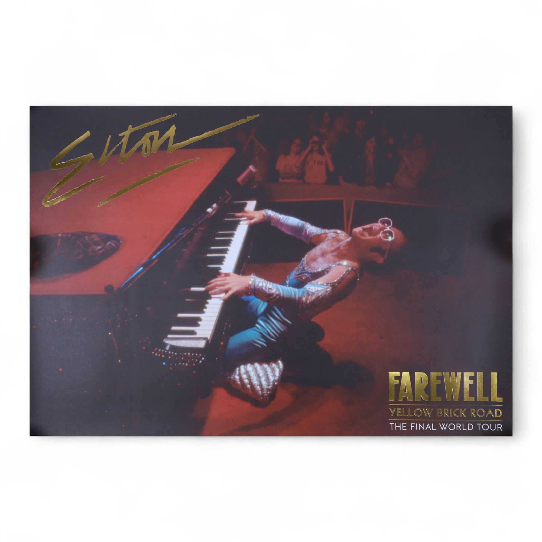 Elton John Farewell Yellow Brick Road tour merchandise, comprising programme, tote bag and VIP giftset with lanyard, wallet, luggage tag and keyring, in white box with gilt lettering, together with two limited edition Farewell Yellow Brick Road lithographs