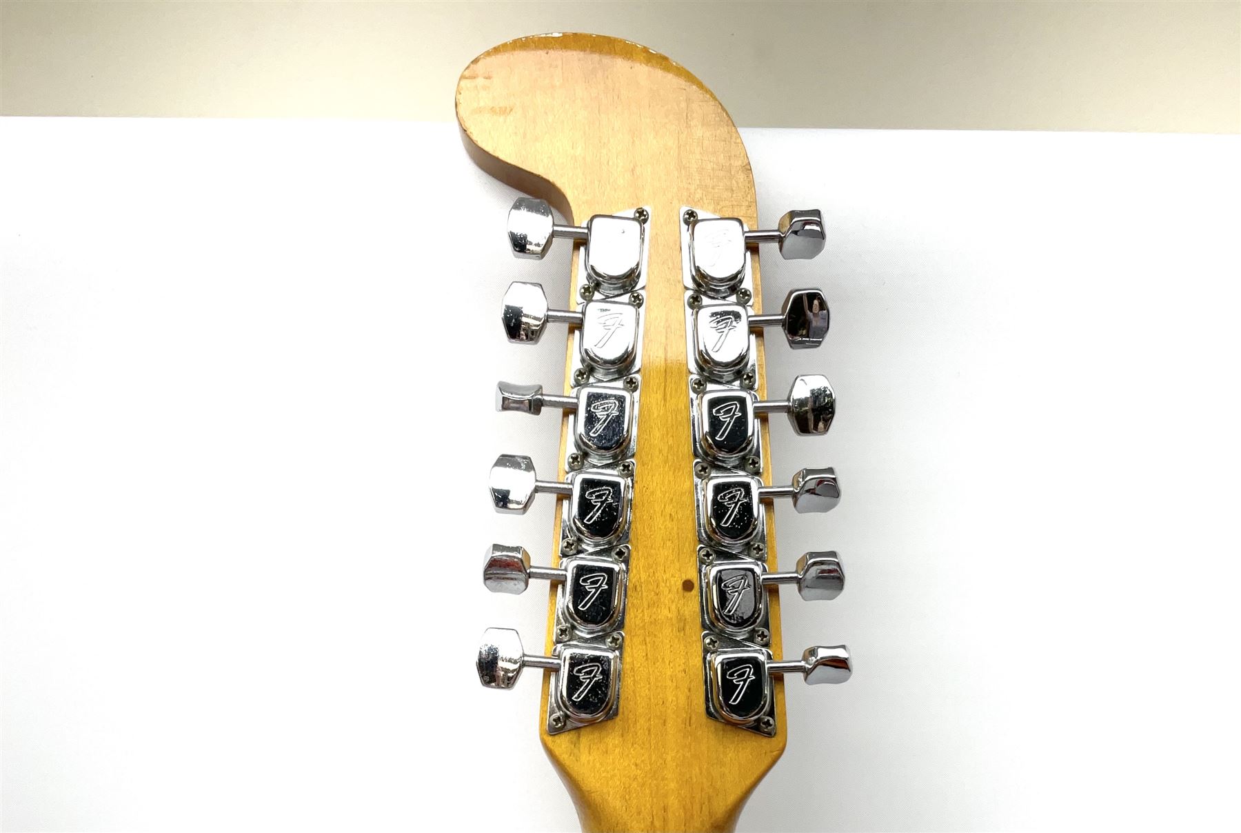 Fender three-tone Sunburst 12-string electric guitar c1965/6 Fullerton USA, with alder body and maple neck, the Indian rosewood fretboard with twenty-one frets and pearloid dot markers, fender electric XII bridge, F-stamp tuners (non-original), two split single coil pick-ups, master volume and tone and four-way switch, serial no.129730, L108cm; in original Fender case bearing label for Rivington Guitars New York with copy of original invoice; together with GuitarKes set-up and service certificate dated October 2021

