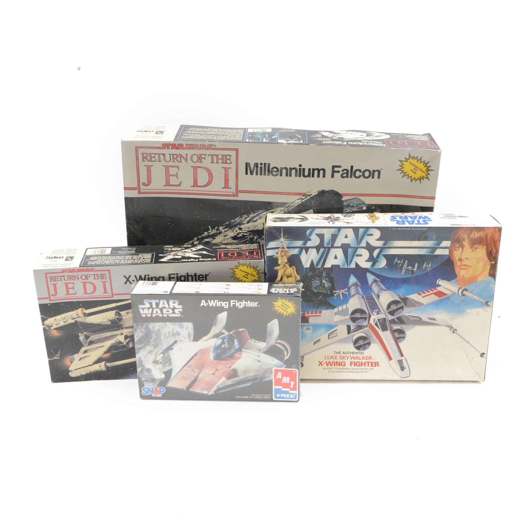 Four Star Wars model kits, comprising AMT ERTL A-Wing Fighter, in sealed packaging, MPC ERTL Return Of The Jedi Millennium Falcon, MPC ERTL Return Of The Jedi X-Wing Fighter and Denys Fisher Luke Skywalker's X-Wing Fighter, all boxed 