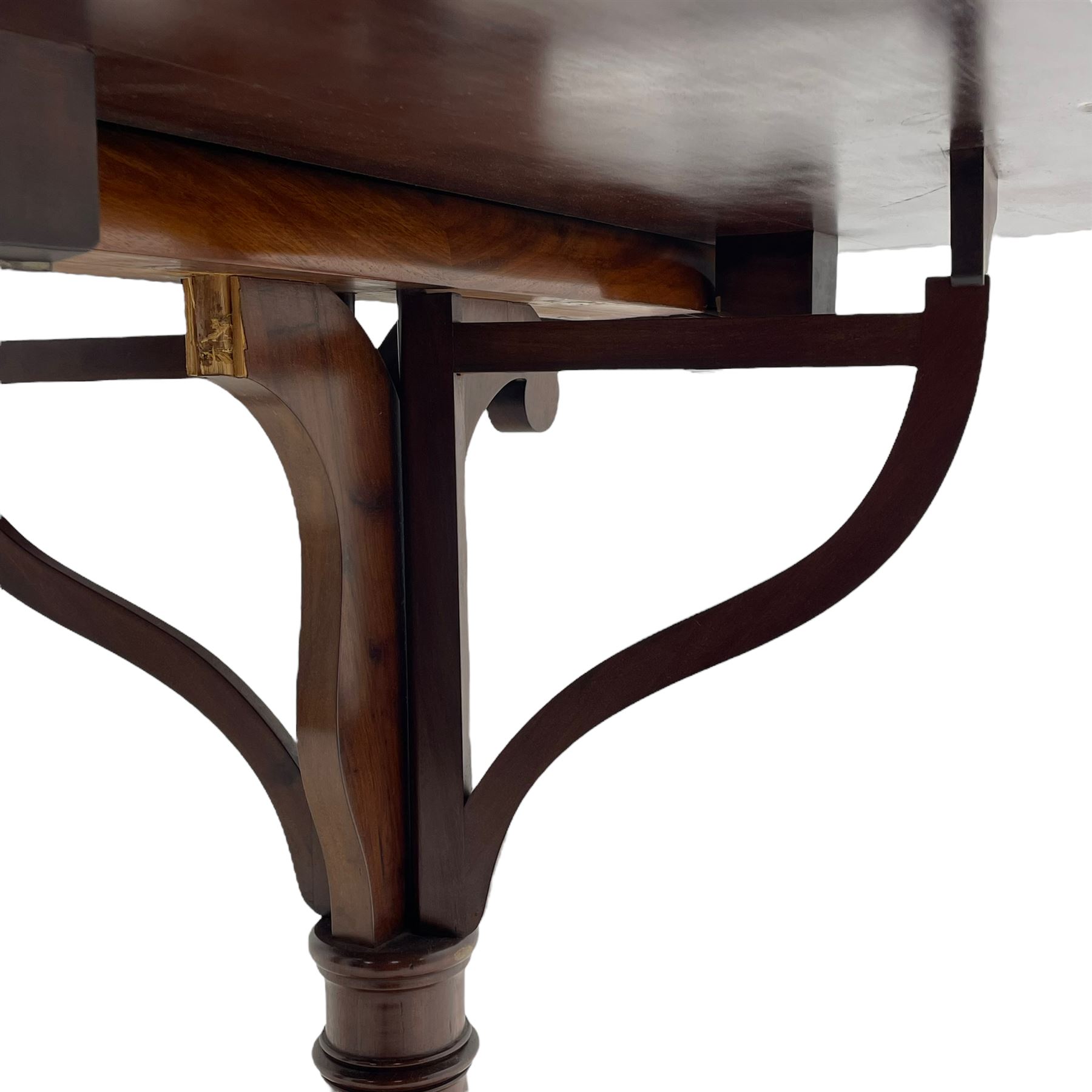 Unusual William IV mahogany Sutherland table, figured and book-matched rectangular drop-leaf top on cylindrical barrel movement, turned roundels to each end, on turned pedestal with acanthus carved baluster, shaped platform with four extended paw feet
