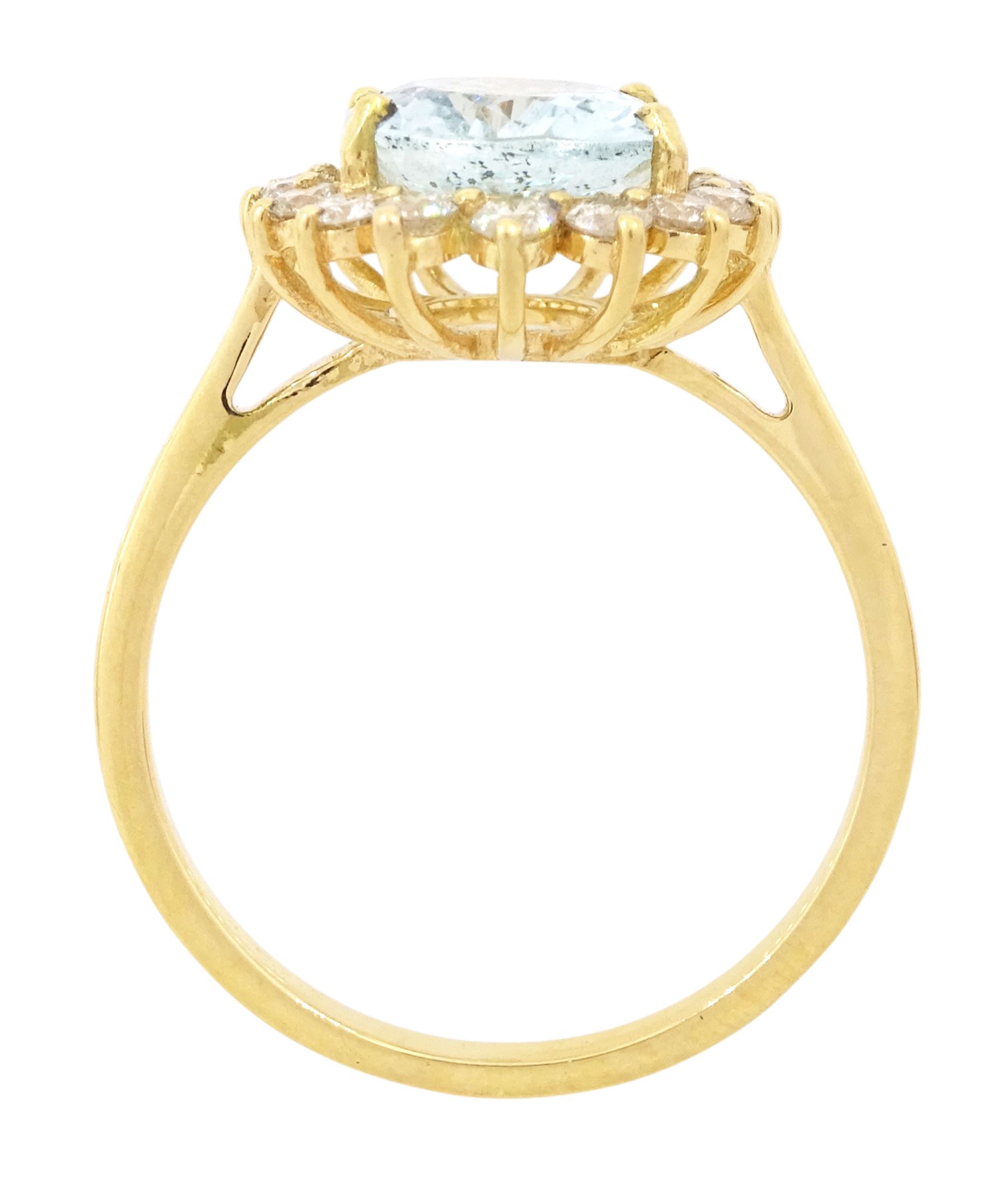 18ct gold aquamarine and diamond cluster ring, single oval cut aquamarine of approx 2.05 carat, surrounded by sixteen round brilliant cut diamonds, stamped, total diamond weight 0.40 carat
