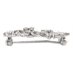 9ct white gold abstract open work brooch, set with four round brilliant cut diamonds, stamped 9.375