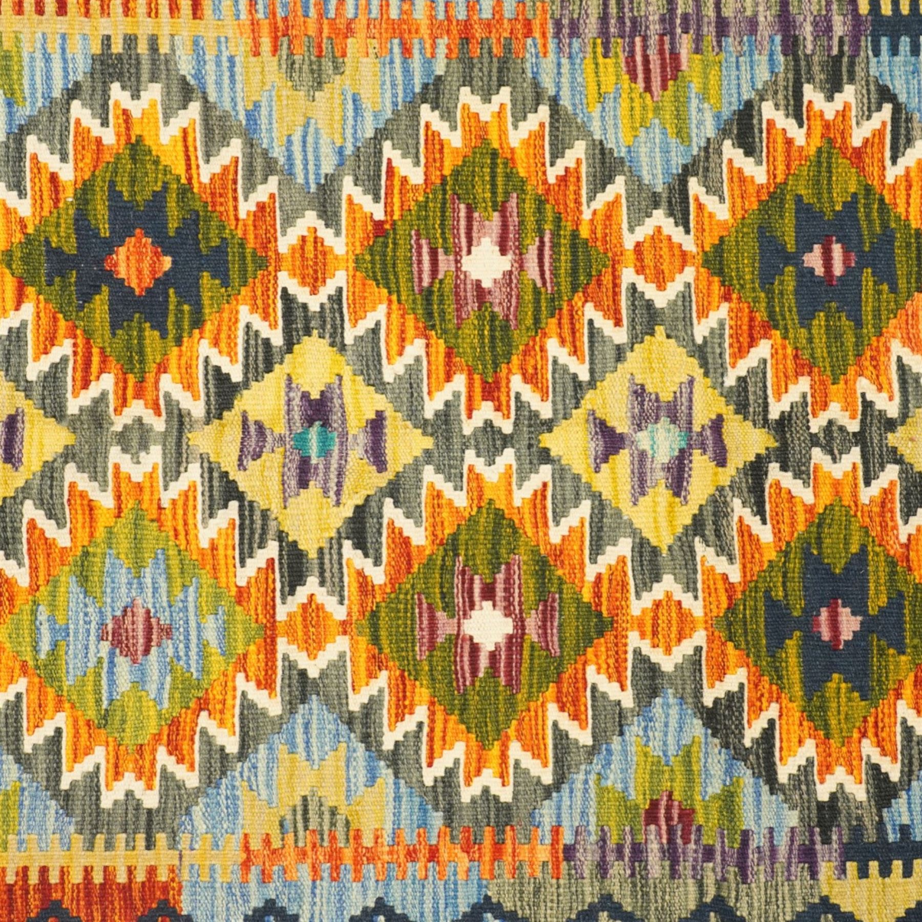 Afghan Maimana flatweave kilim and an Afghan Chobi flatweave kilim runner, with a repeating stepped diamond medallion design in ivory, green, rust, teal, purple, and indigo, framed by chevron and geometric borders, 153x50cm & 127x80cm, (2)