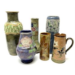 A group of Royal Doulton vases of various form and decoration, to include a vase of cylindrical form with relief moulded flower head decoration upon a mottled blue ground, H27cm, a vase of baluster form with tubelined decoration of roses, H29.5cm, etc. 