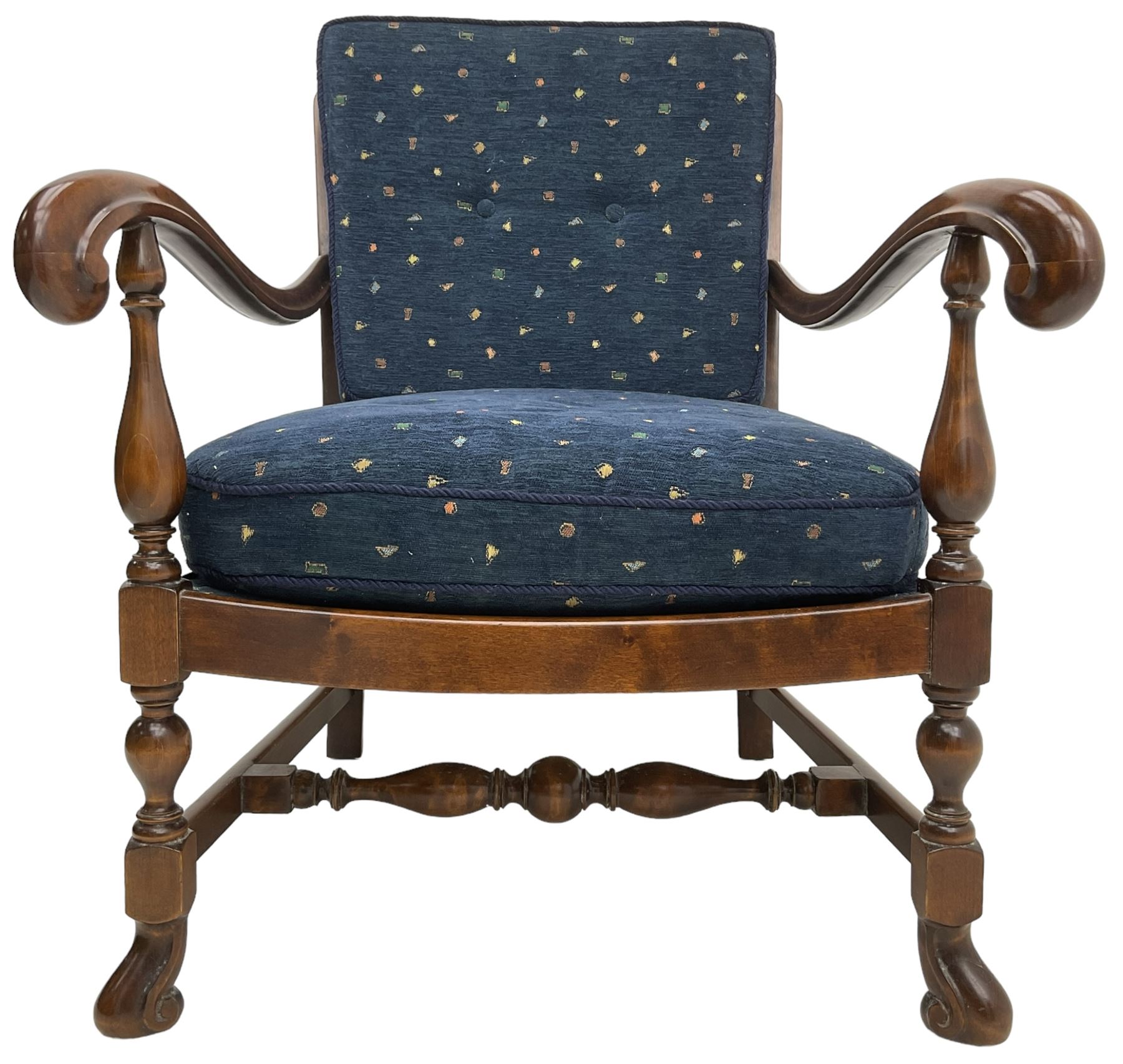 Early 20th century stained beech framed armchair, cane panel back over scrolled arm terminals, raised on turned supports united by turned H-stretcher, with patterned blue upholstered loose back and seat cushions