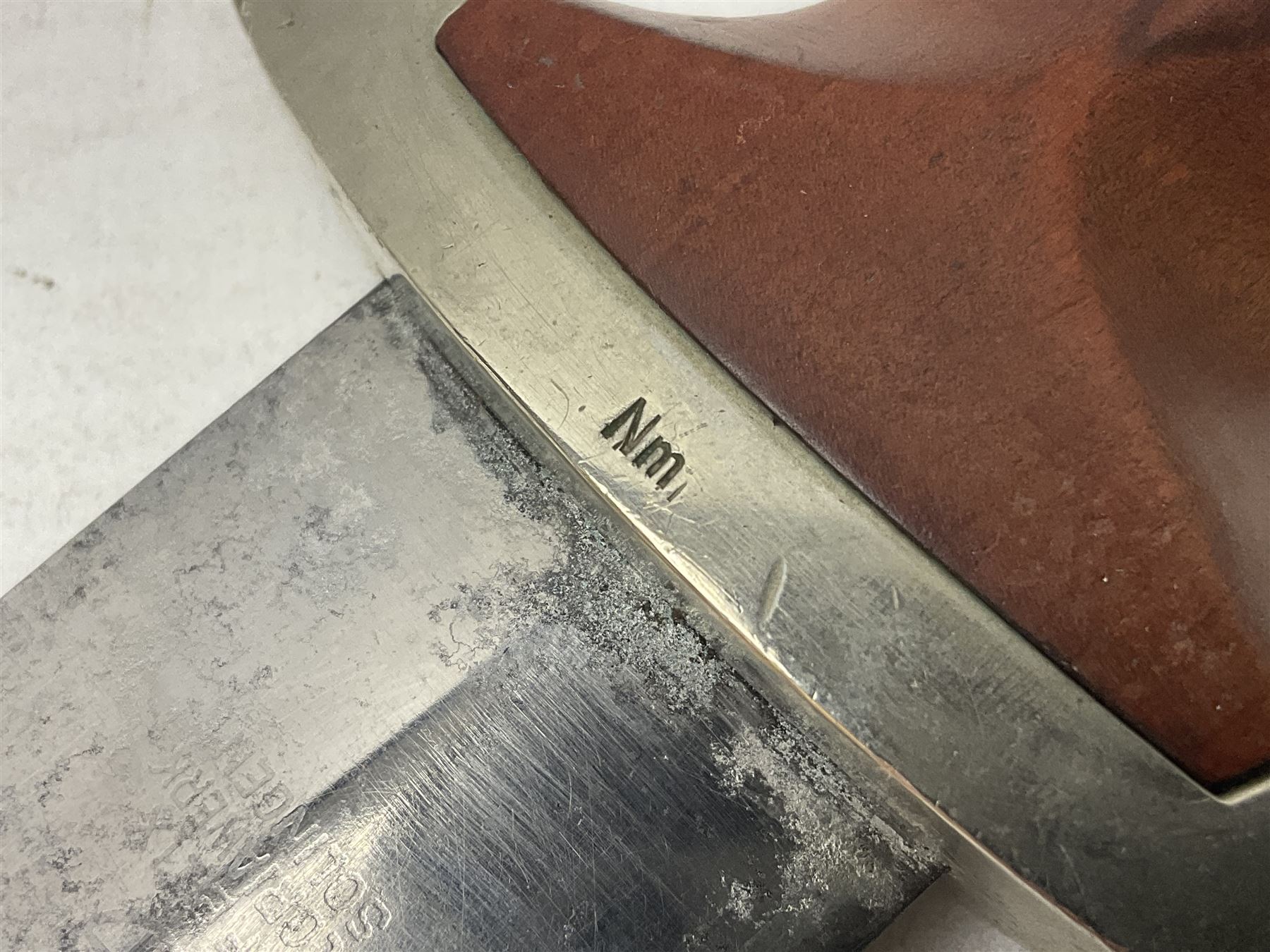 WW2 German SA dagger the 22cm double edged steel blade by G. Felix Gloriawerk Solingen inscribed 'Alles Fur Deutschland', the cross-piece impressed with the SA Gruppen mark Nm verso for Nordmark, wooden grip inset with eagle and SA emblem; in brown painted scabbard with nickel mounts L37cm overall