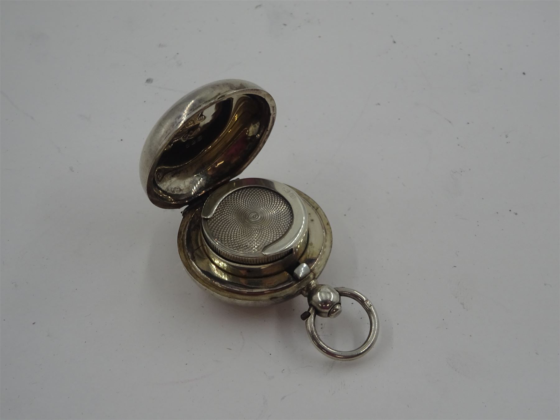 Early 20th century silver sovereign holder, of circular form, engraved with monogram, hallmarked William Luckett, Birmingham 1910, D3.5cm