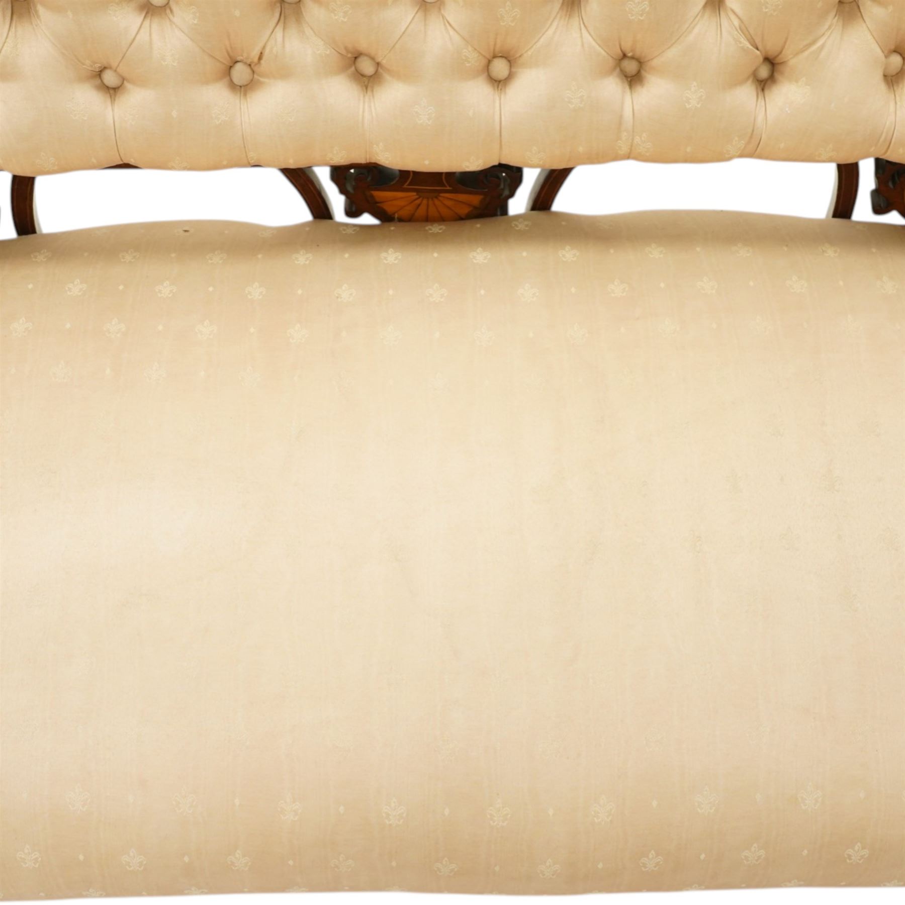 Edwardian inlaid mahogany sofa, upholstered in cream fabric with buttoned back rail, tapering legs on brass castors