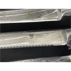 Two cased Swiss knife sets