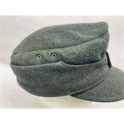 WWII German M43 field cap with 'SS' cloth badge and mountain trooper's edelweiss metal badge