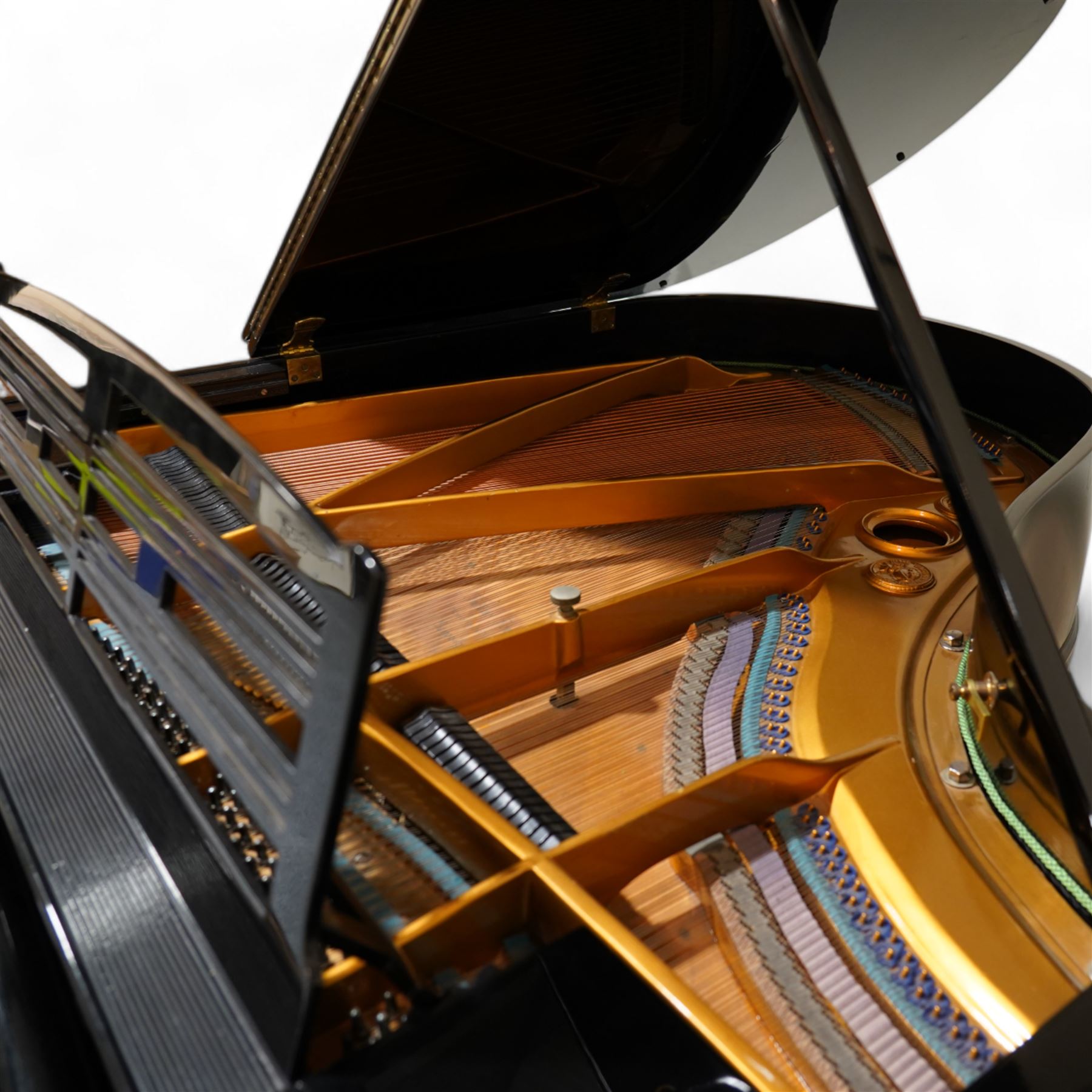 Feurich of Leipzig - German overstrung medium grand piano in a black lacquered case, with a seven octave M&K of Leipzig roller action keyboard, original strings and tuning pins, new hammer heads and dampers, with sostenuto and sustain pedals, adjustable music desk and matching adjustable stool.
