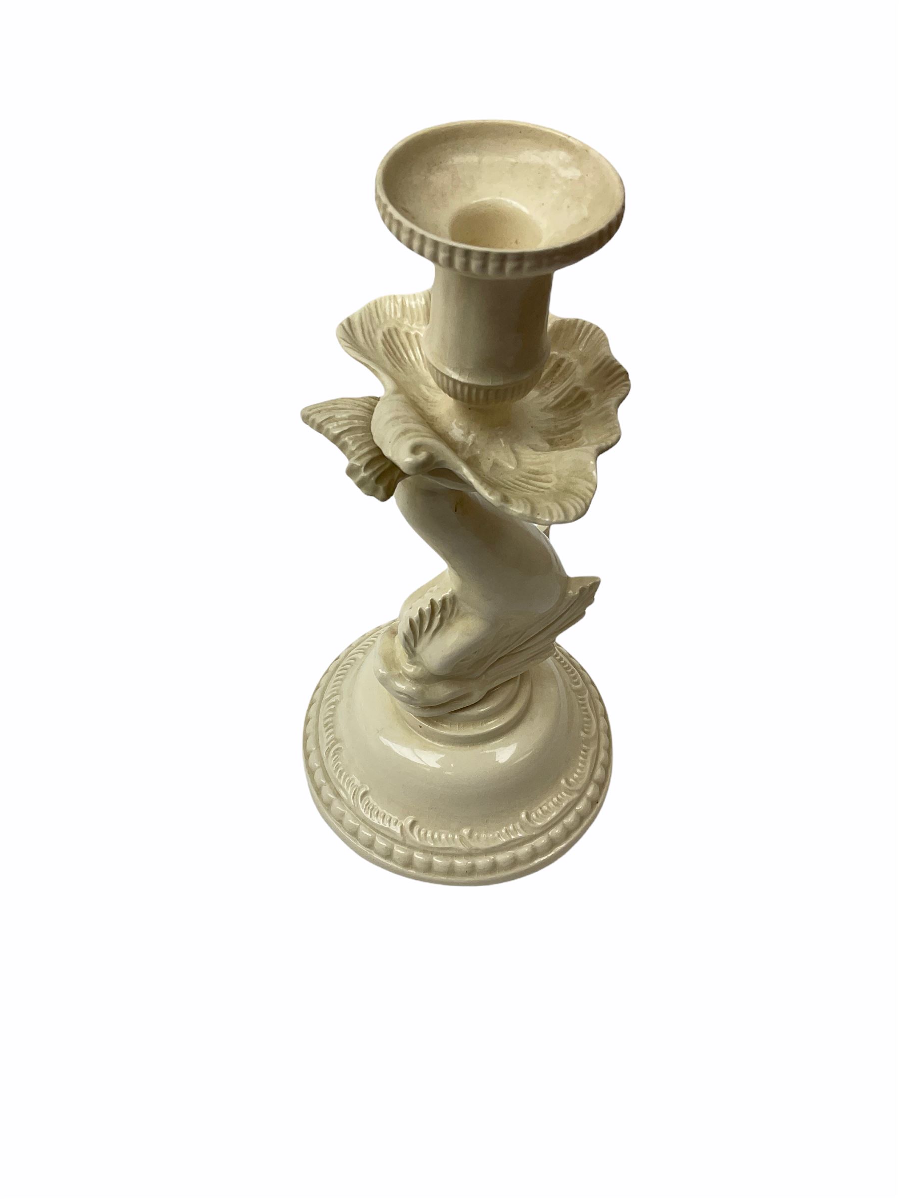 20th century Leeds creamware, comprising chestnut basket and stand, small tureen and cover, ladle, and associated stand, candlestick with stem modelled as a dolphin, teapot, tureen and cover in the form of a melon with fixed stand, and toast rack (toast rack a/f), each with impressed mark beneath. 