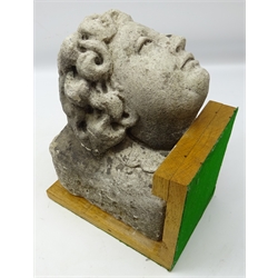  Carved stone corbel carved with a female head, mounted on oak stand, D29cm, W17cm x H22cm   