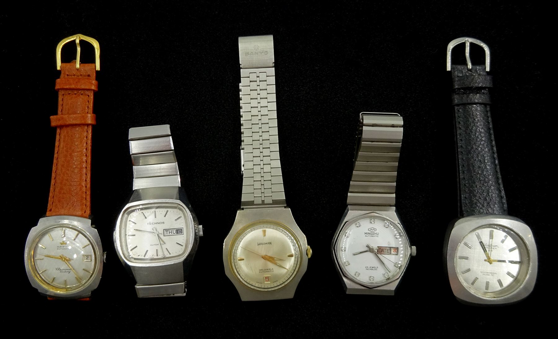 Five automatic wristwatches including Marvin chronometer Victory, Waltham Premier 65, Technos, Waldman and Mingzhu