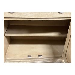 Brunswick - washed oak finish illuminated display cabinet, upper section with four glass-panelled doors enclosing glass shelving, base fitted with two drawers over four paneled cupboard doors, each fitted with distinctive round metal handles, raised on plinth base