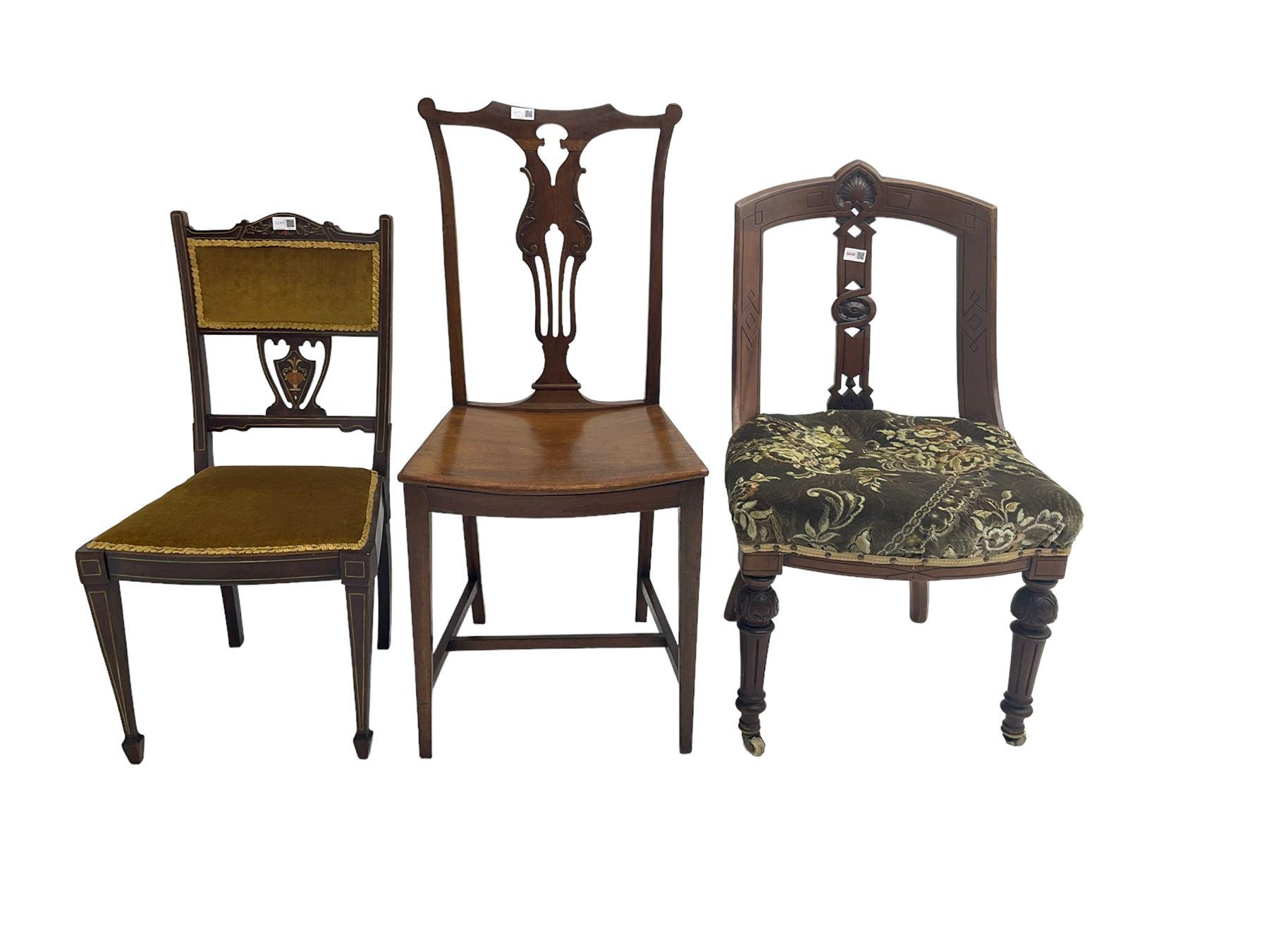 Late 19th mahogany nursing chair, cresting rail with carved cartouche, central splat pierced and carved with flowerhead and geometric design, upholstered seat, raised on turned and fluted tapering supports with brass and ceramic castors; George III Chippendale-style mahogany dining chair, shaped cresting rail with pierced and scrolled slat back; small Edwardian inlaid mahogany bedroom chair, pierced and inlaid urn design, upholstered seat and back (3)