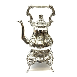 A Victorian style silver plated teapot on stand, each with foliate decoration throughout, overall H42.5cm. 