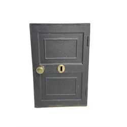 Black painted cast iron safe, hinged door opening to reveal single drawer