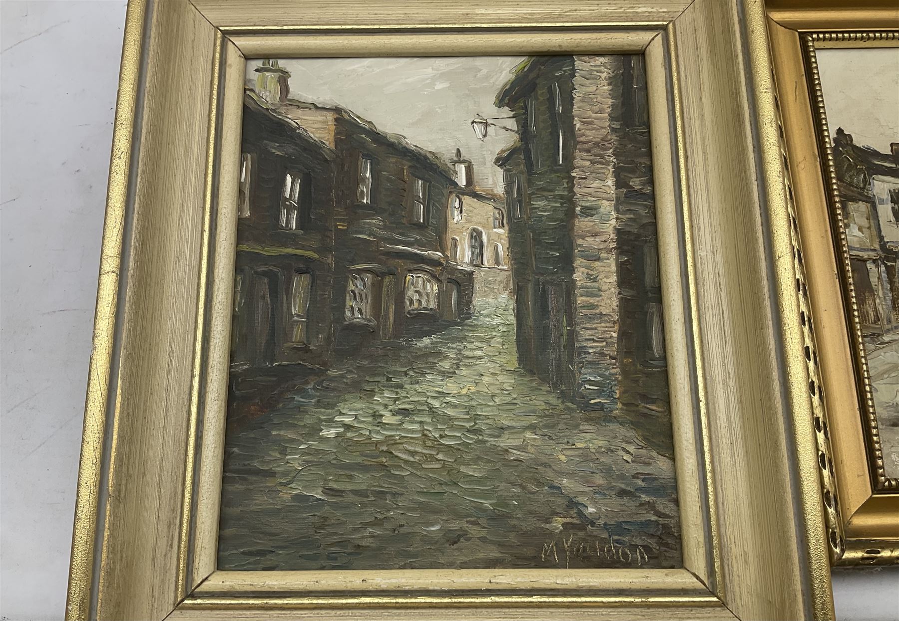 Barbara C Shaw (Northern British 20th century): 'Lane into Thorpe' and 'Main Street', two oil on boards signed together with M Yeadon (Northern British contemporary): 'Howarth Main Street Bronte Country', oil on board signed max 24cm x 39cm (3)