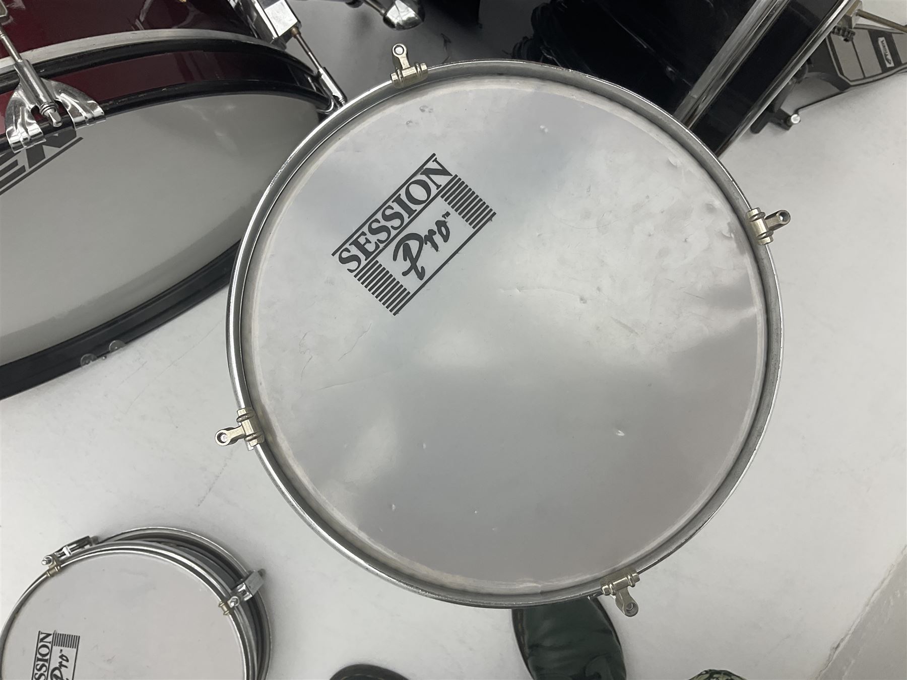 Rockburn eight-piece black drum kit with bass drum, floor tom and five other toms and snare drum; together with two other snare drums; Haosen bass drum; four cymbals; various stands, foot pedals, stool, tri-angle, drum sticks etc