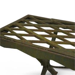 Two cast iron garden benches, rectangular seat with lozenge grate panels, on X-framed supports 