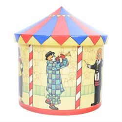 Dennis Chinaworks circus tent jar, designed by Sally Tiffin, the body decorated with clowns, upon a yellow ground, the lid decorated as a circus top, limited edition 12/25, impressed and painted marks beneath 