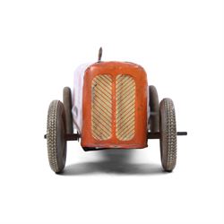 Mettoy tinplate clockwork racing car, the boat tailed red body with lithographed details, racing no. 7, with Dunlop Fort tyres, driver and key, H8cm, L32cm