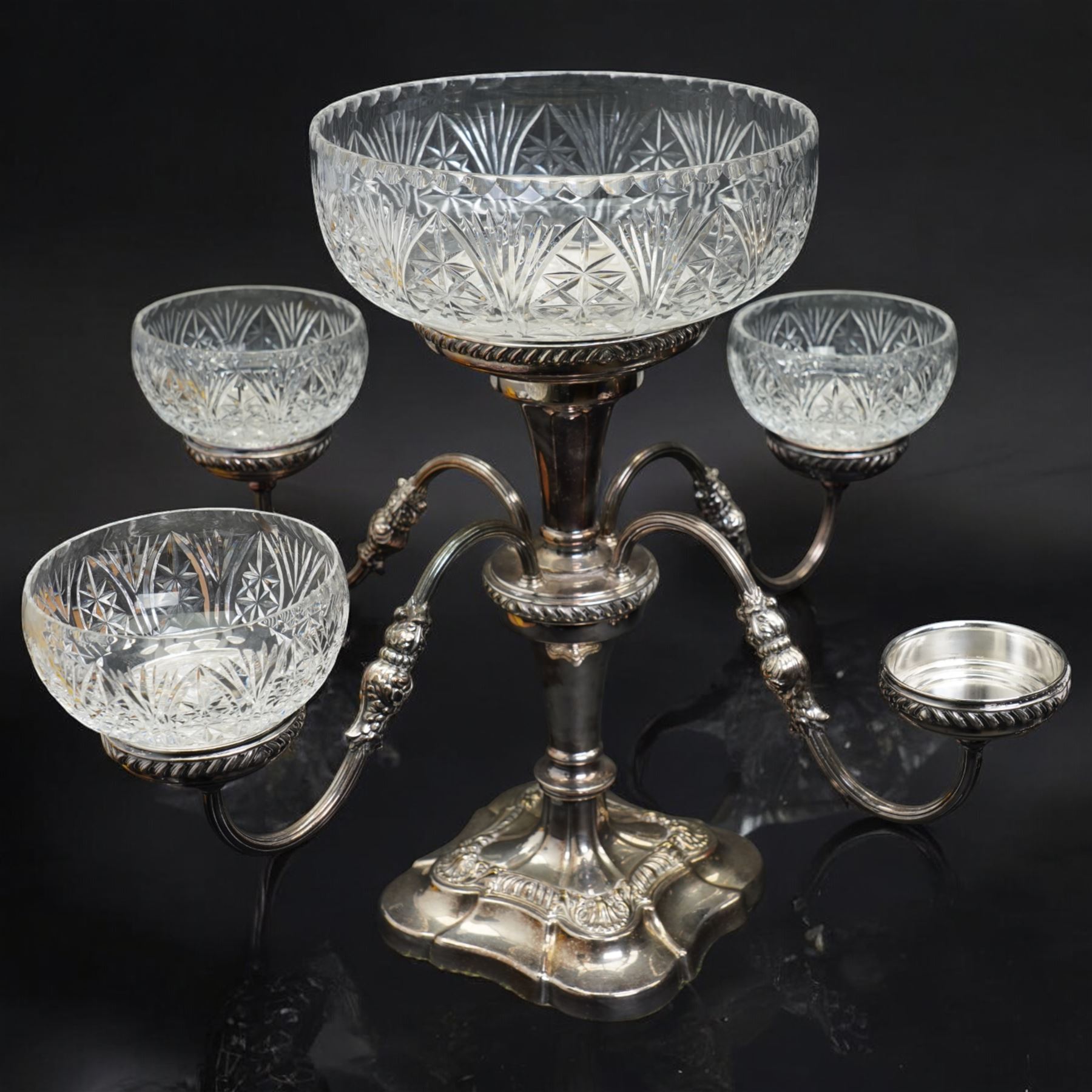 Silver plated four branch centrepiece set with glass bowls and a larger centre bowl and with interchangeable candle sconces H37cm  and a plated punch bowl with lion mask handles D37cm (2)